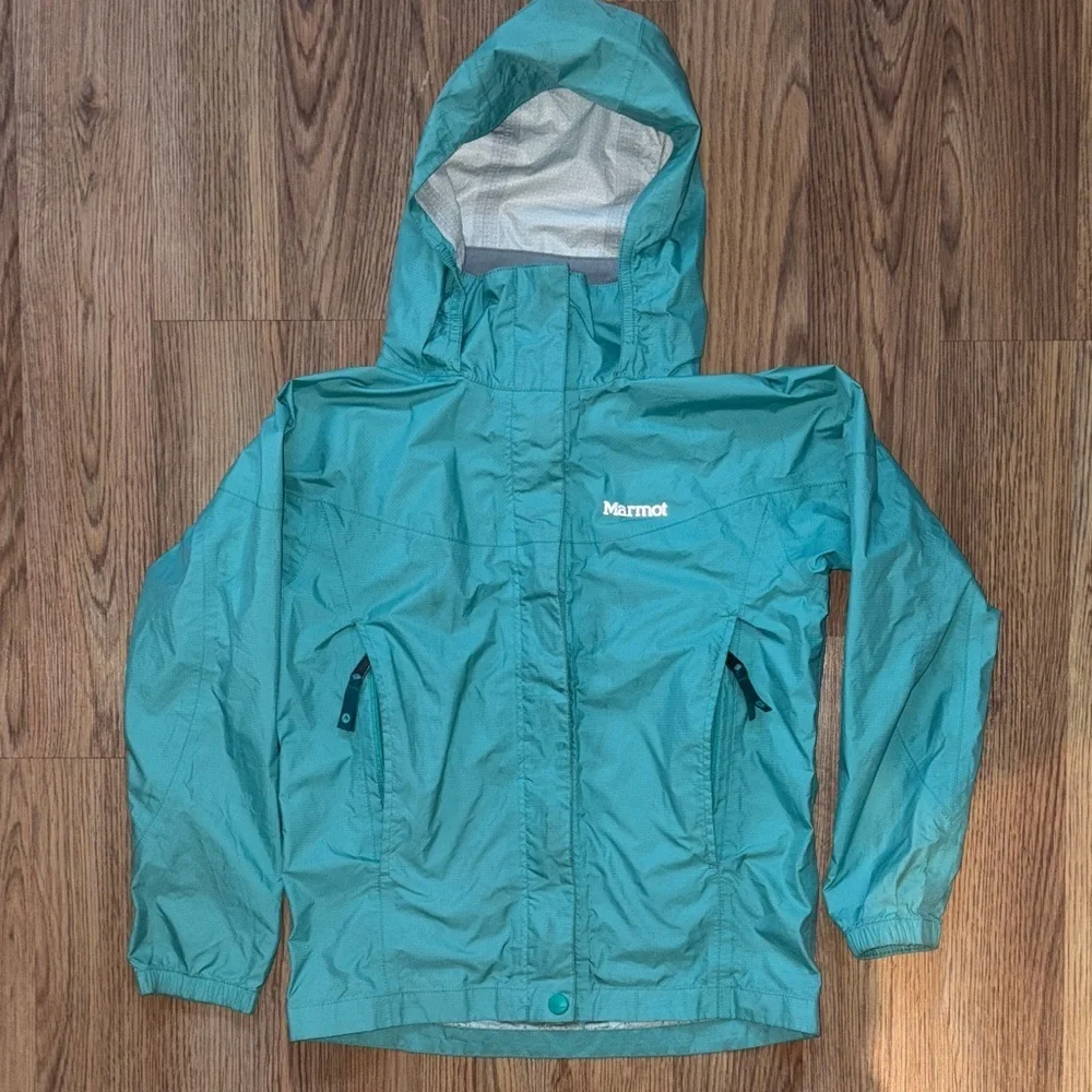 Girls waterproof jacket Marmot. Windproof. Outdoor performance wear.